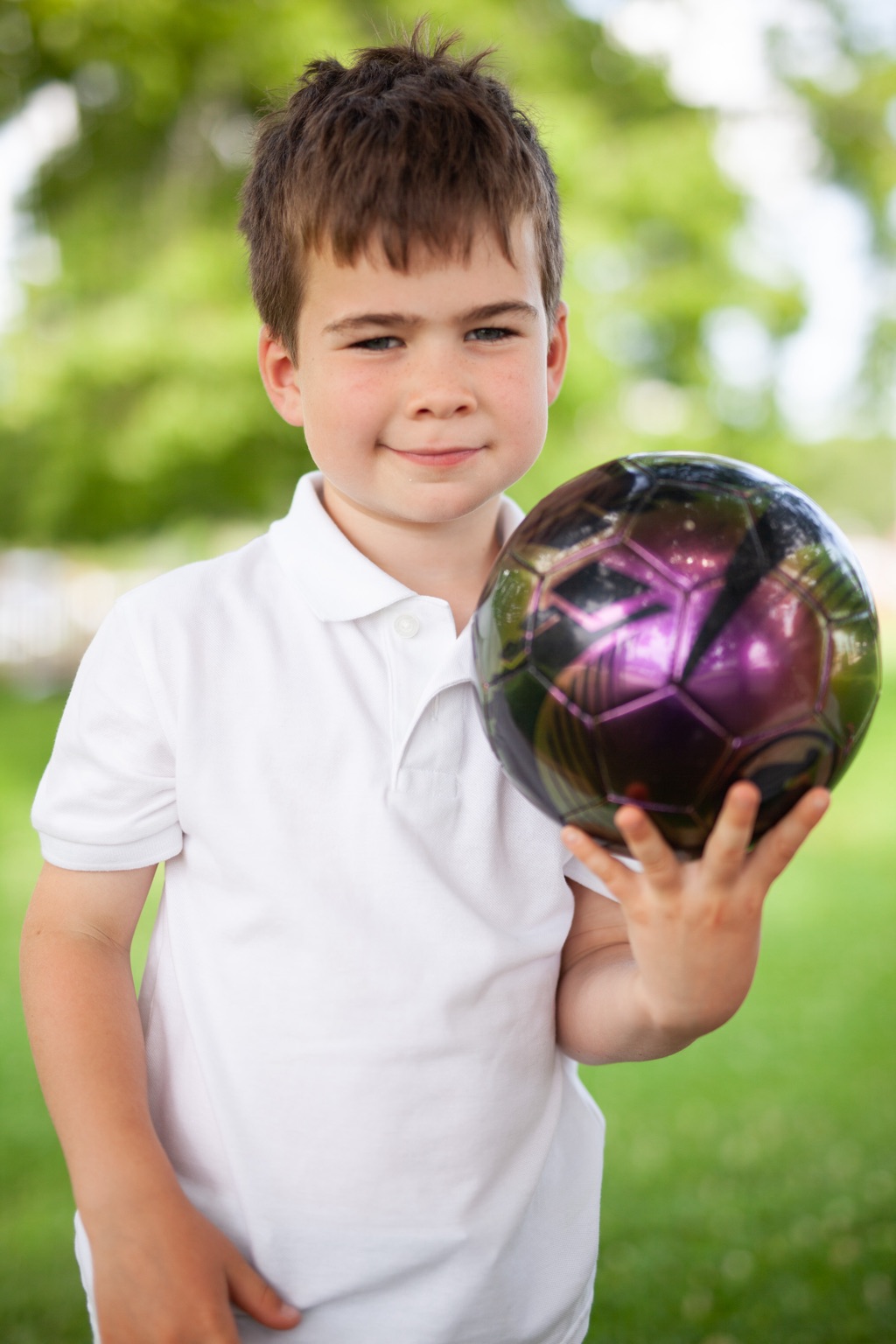 Portrait of a boy with a soccer ball