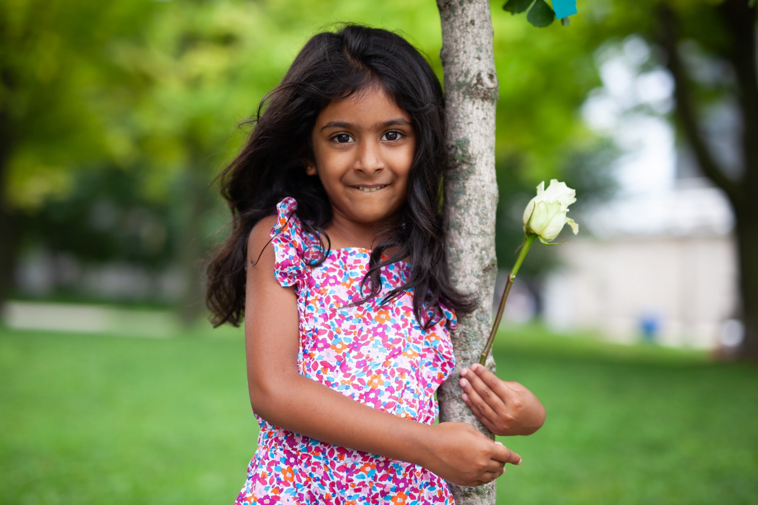 Portrait of a girl holding a flower