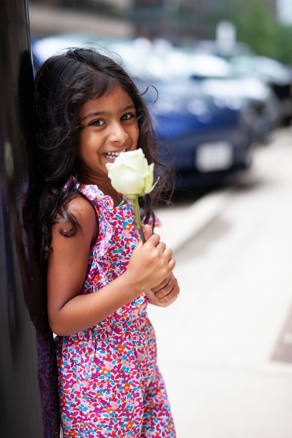 Portrait of a girl holding a flower